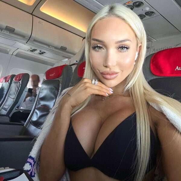 Model Shames Peeping Snapper As She Strips Off For Plane Selfies